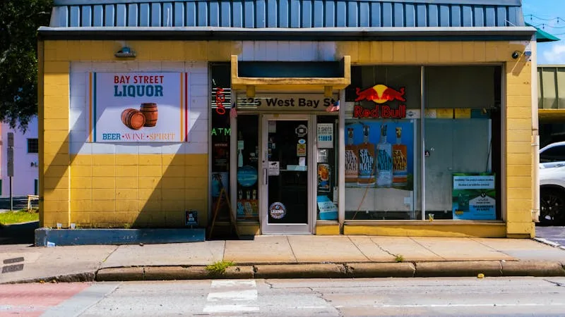 Local liquor store storefront on a quiet street