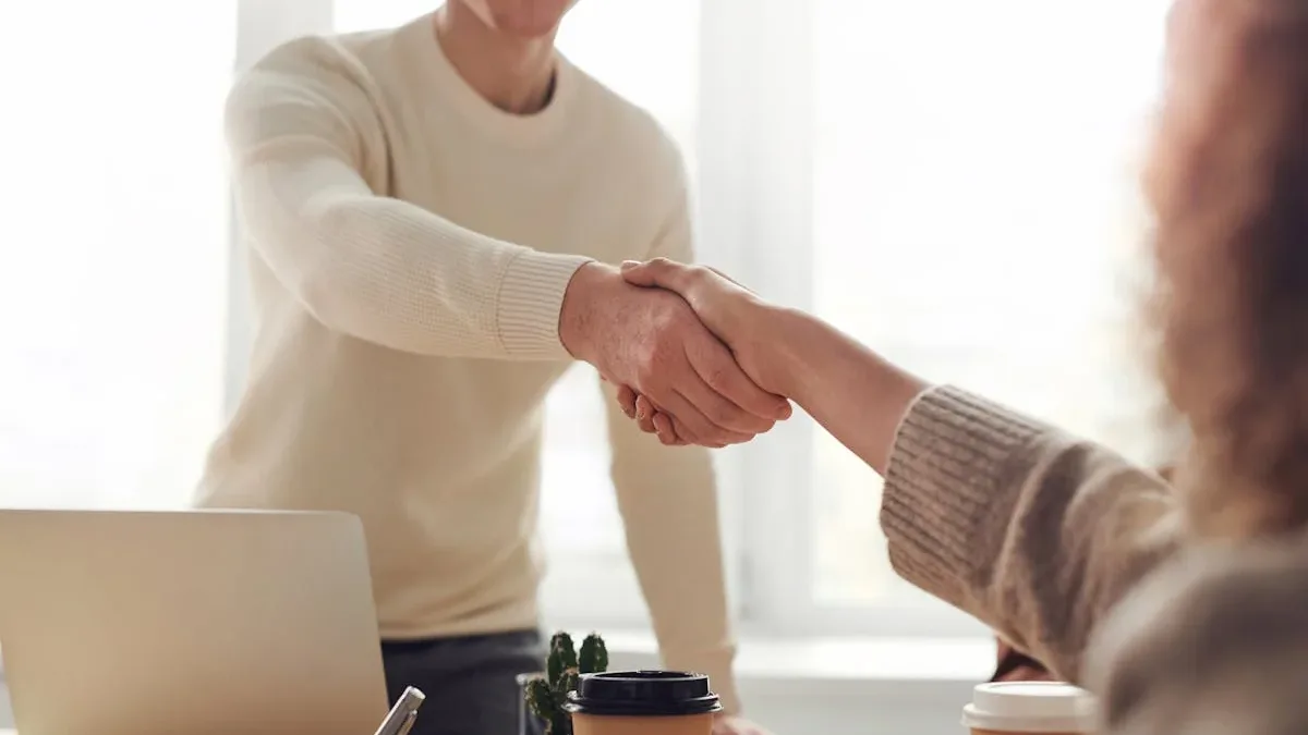 Web designer and moving company owner discussing website project