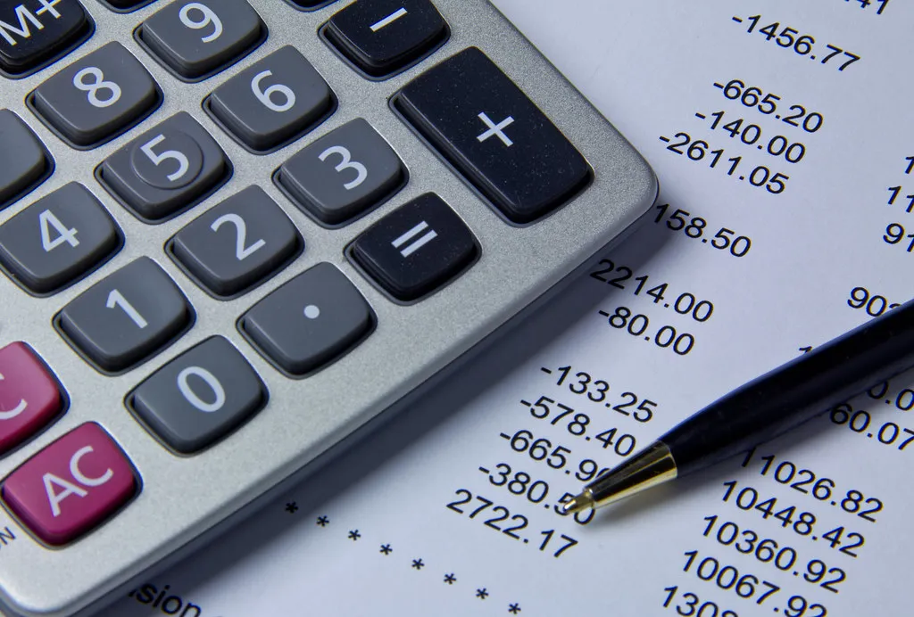 Financial documents and calculations for business profit margin analysis